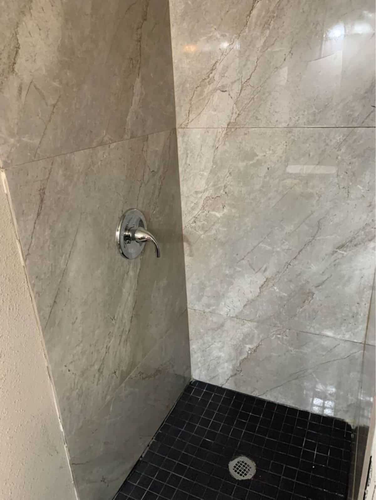 separate shower area in master bathroom of stunning 2 bedroom tiny home
