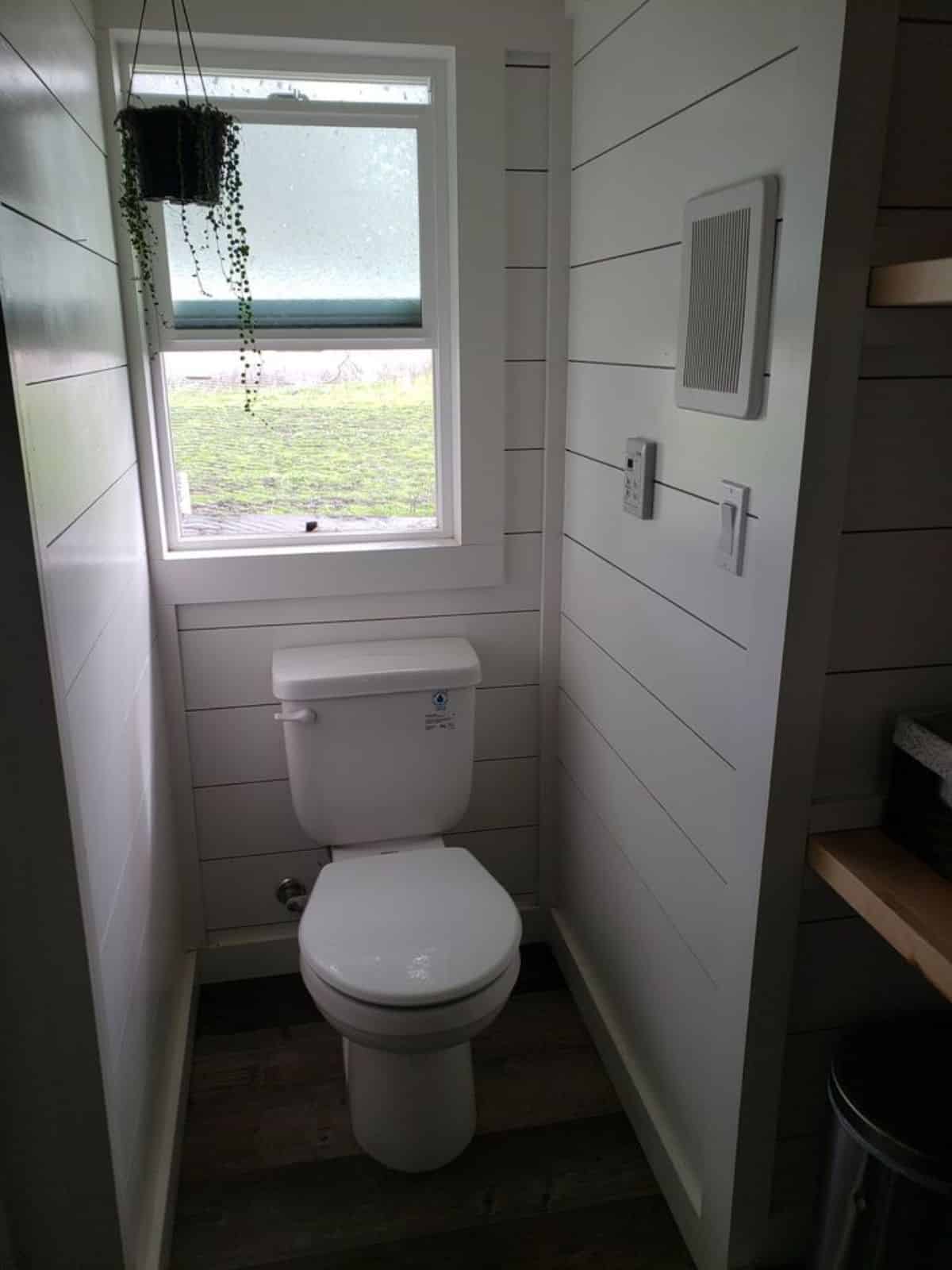 standard convertible to composting toilet toilet in bathroom