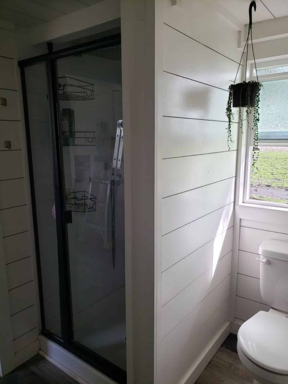 separate shower area with glass enclosure in bathroom