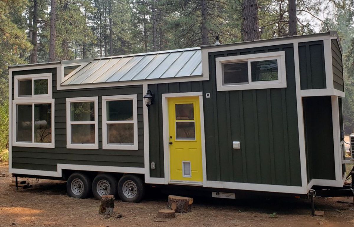 main entrance view of stunning 28’ tiny house