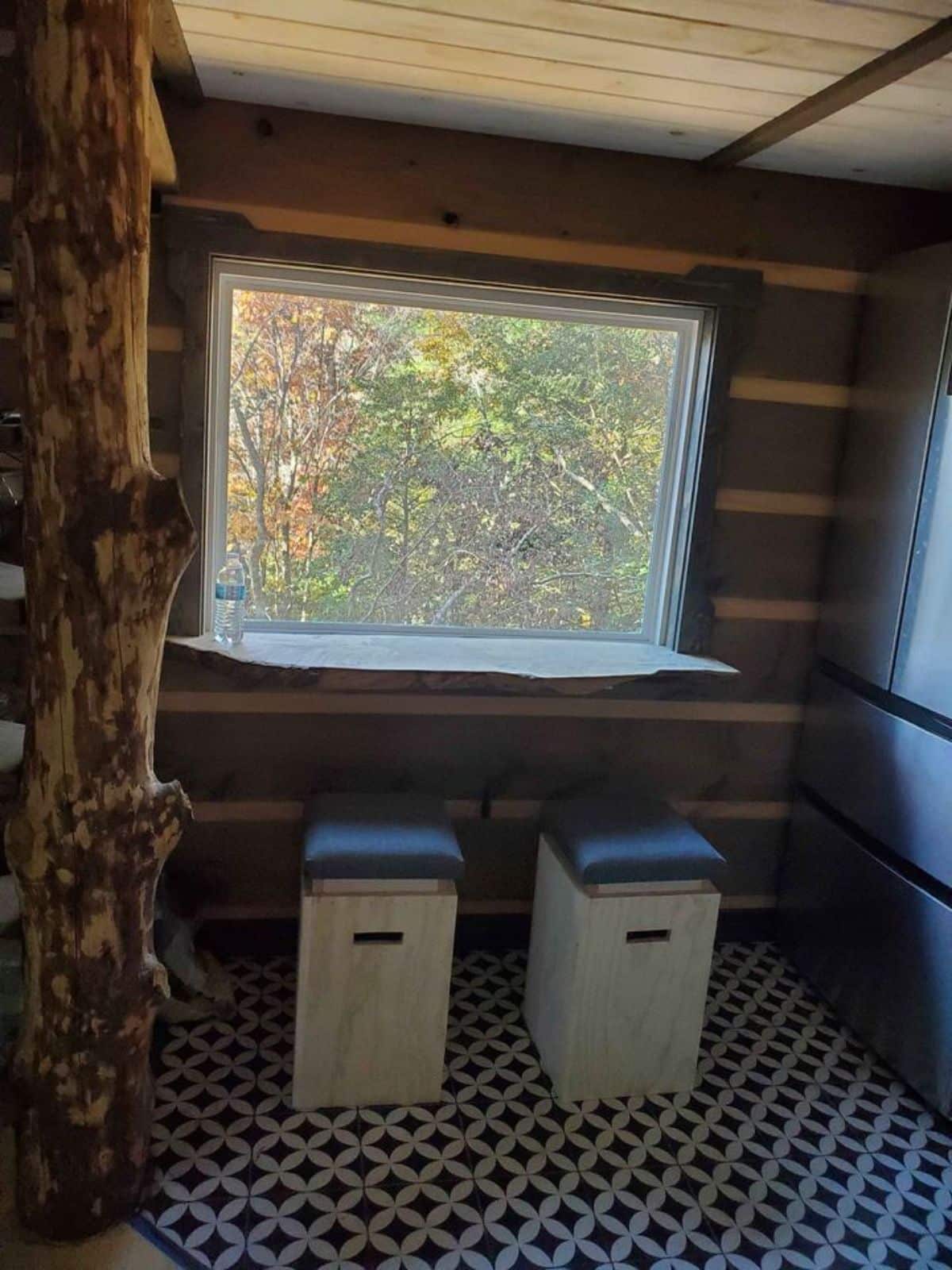 dinning area besides the huge window of offgrid tiny home