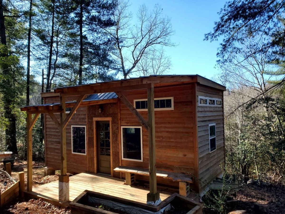 stunning wooden exterior of offgrid tiny home