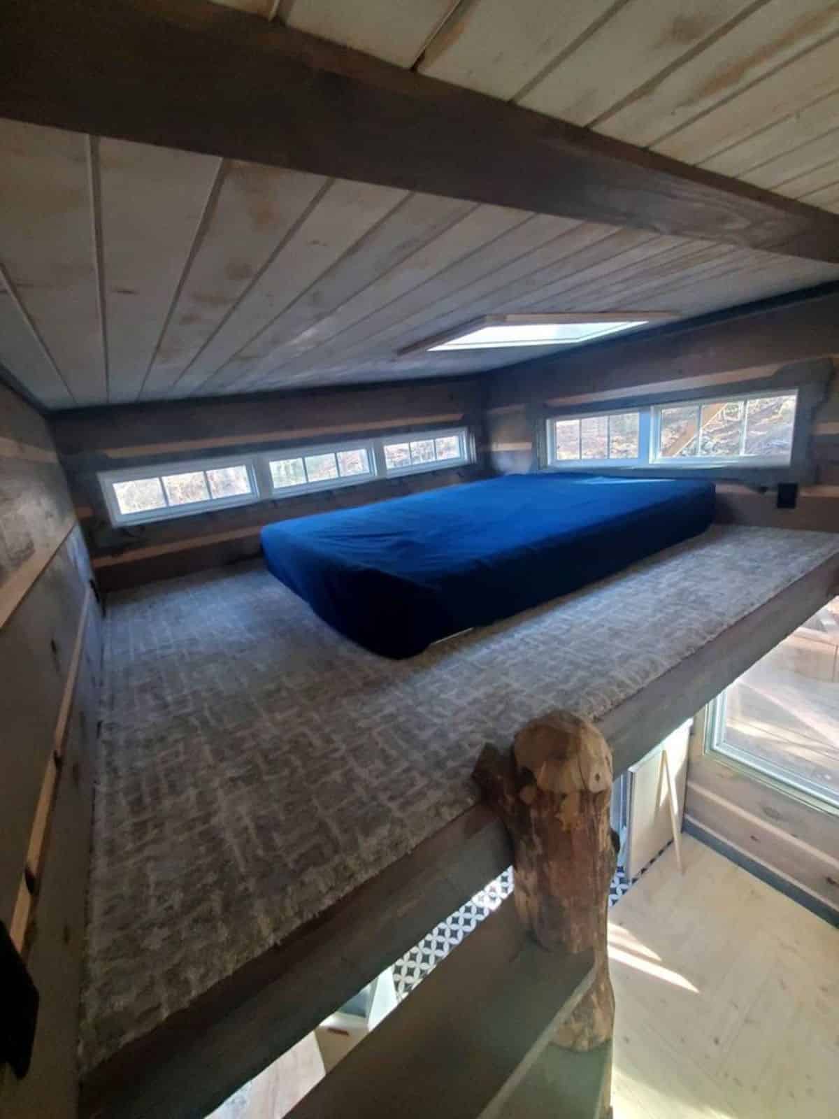 comfortable mattress on loft of offgrid tiny home