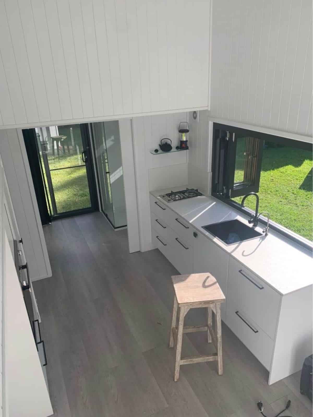 stunning white interiors and open floor view of three bedroom tiny home