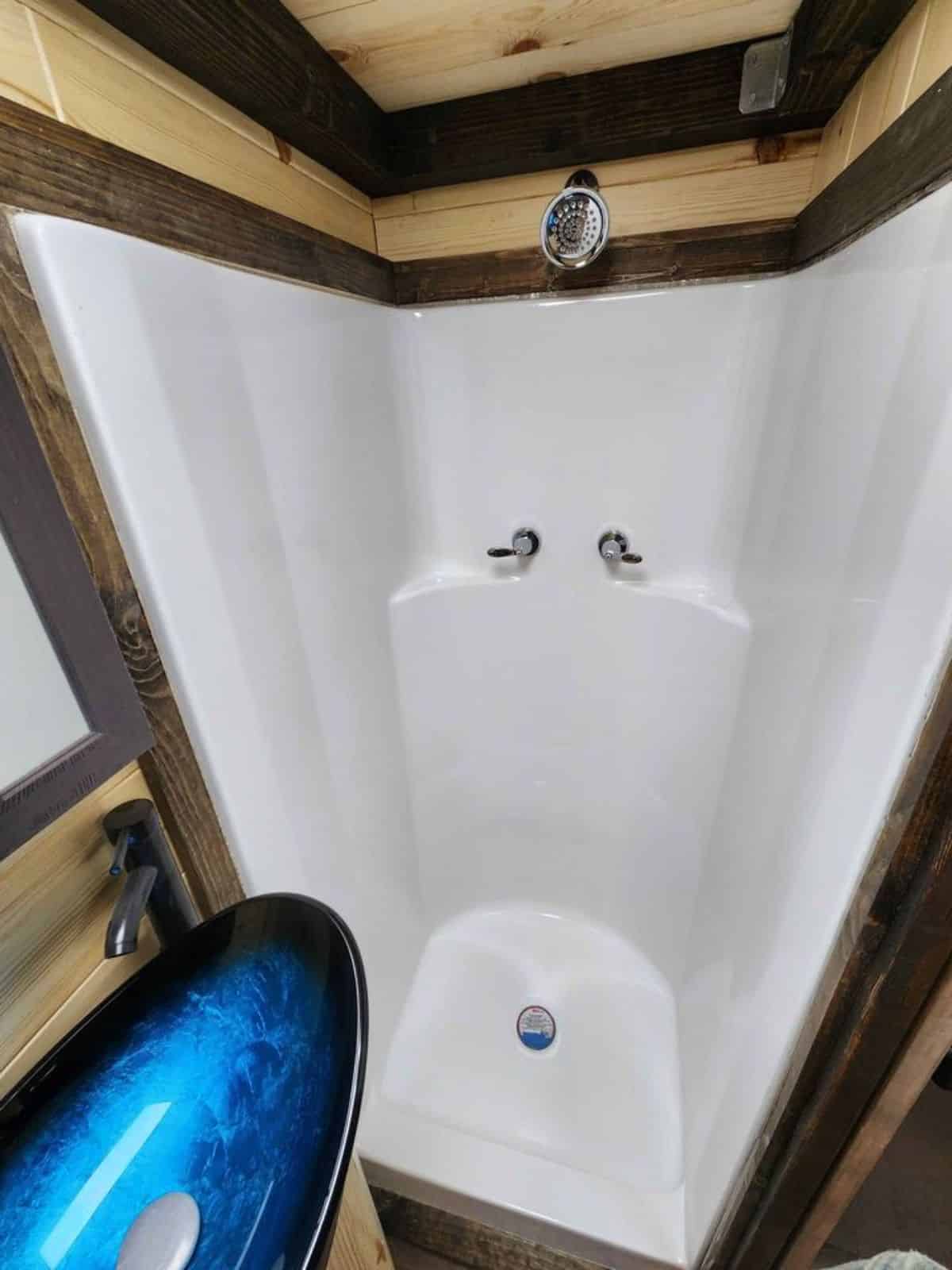 separate shower area in bathroom of tiny towable home