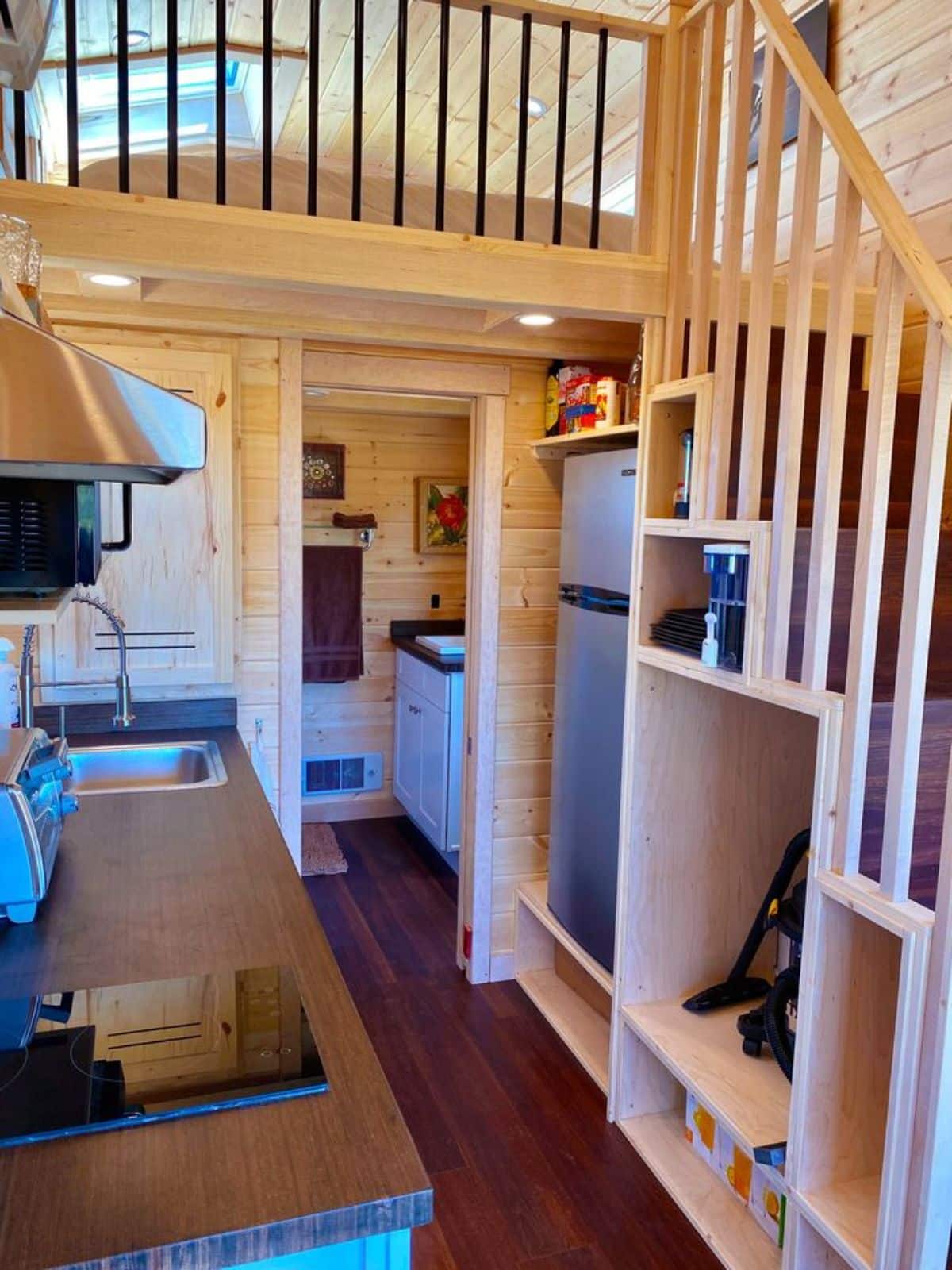 multi purpose stairs with appliances under the stairs