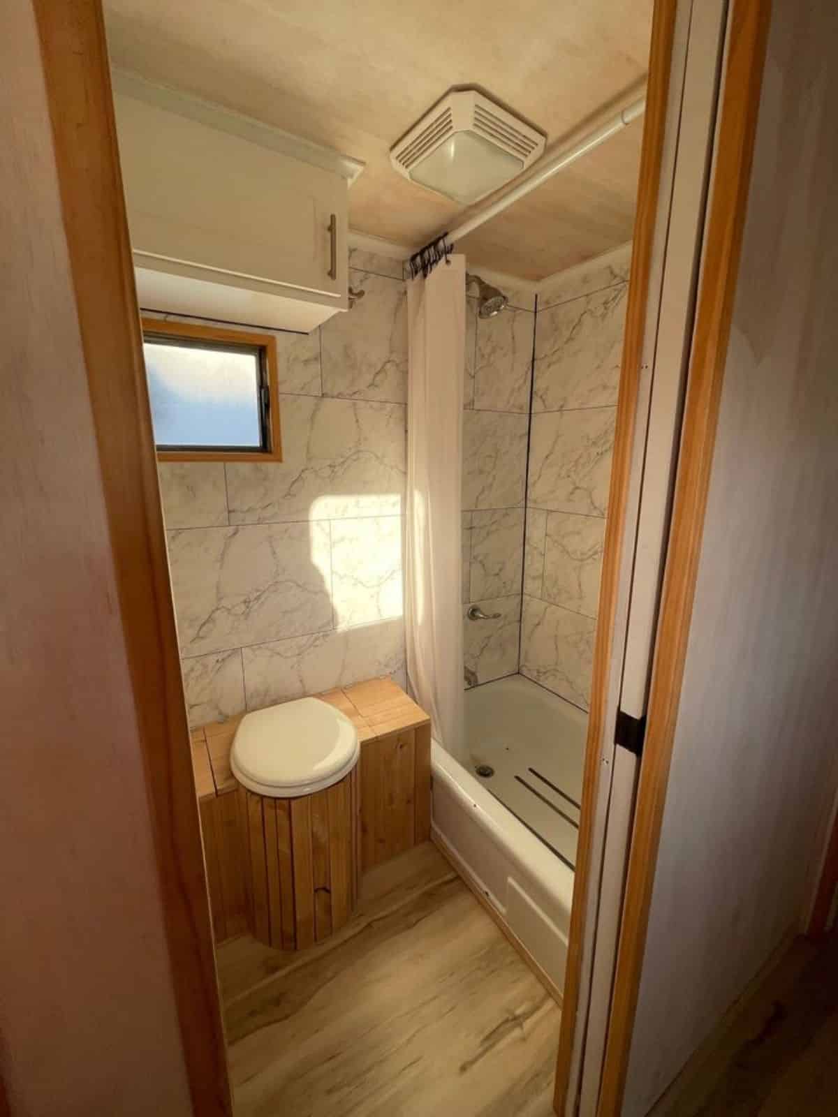 stunning bathroom of vintage tiny home has all the standard fittings