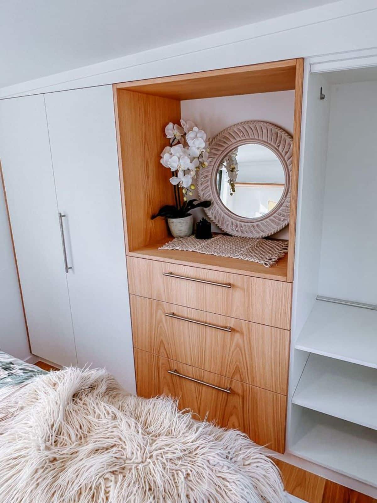 storage cabinets in bedroom of 2 bedroom tiny house