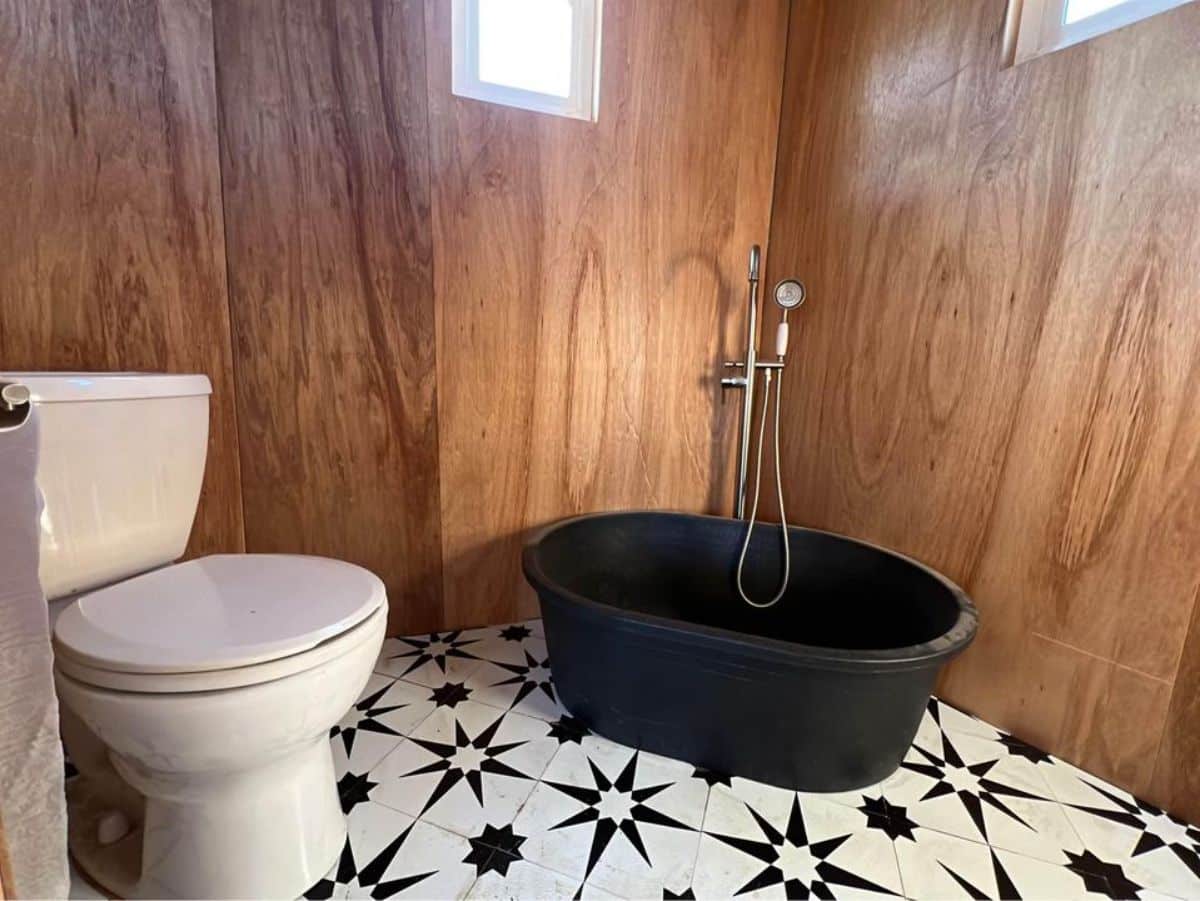 bathroom of insulated tiny home has all the standard fittings