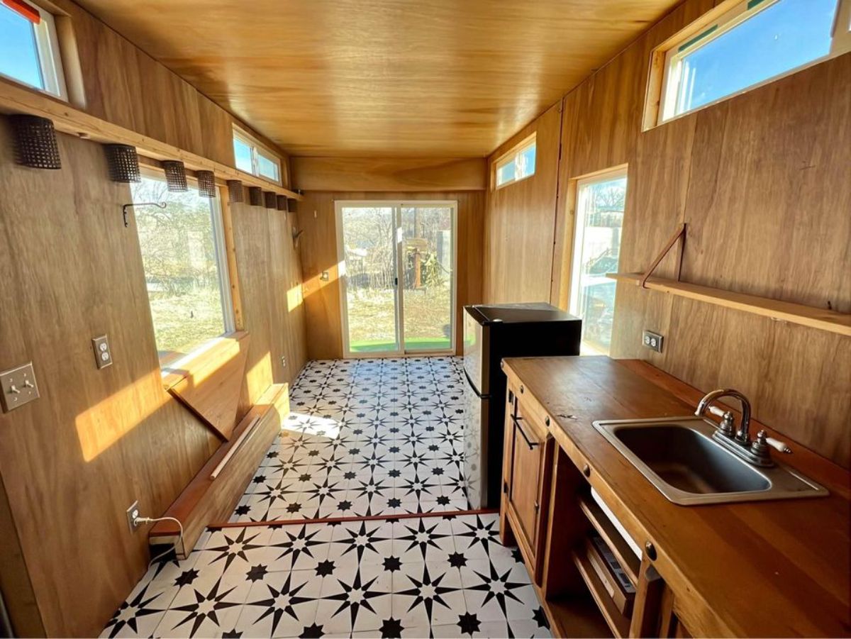 wooden walls and living area of insulated tiny home