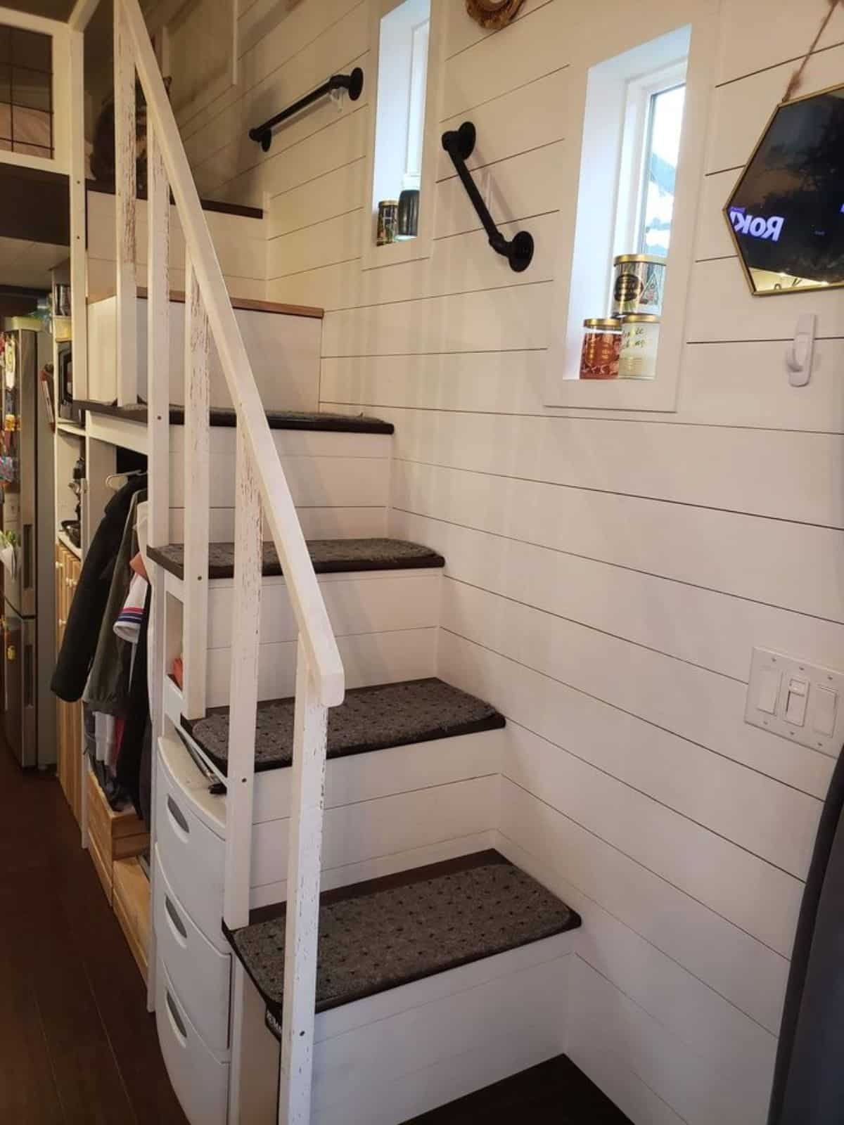 multi purpose stairs leading to the loft bedroom of 24’ tiny home