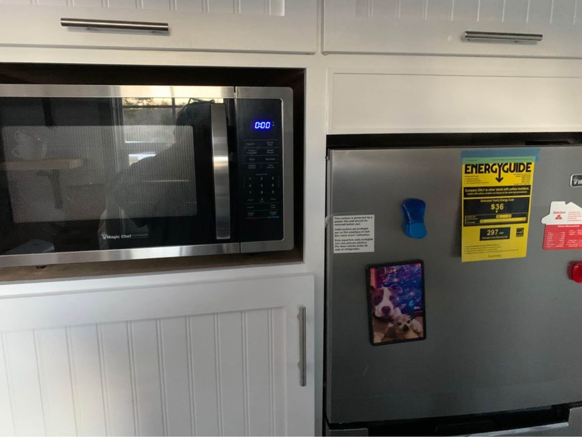 microwave oven and double door refrigerator in the kitchen