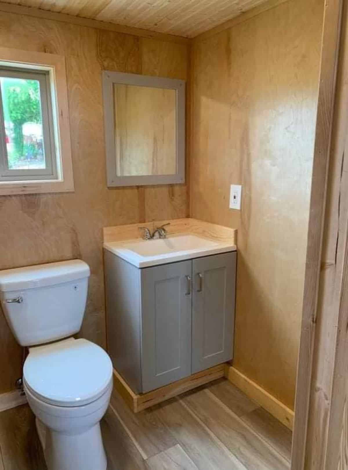standard fittings in bathroom of handcrafted tiny home