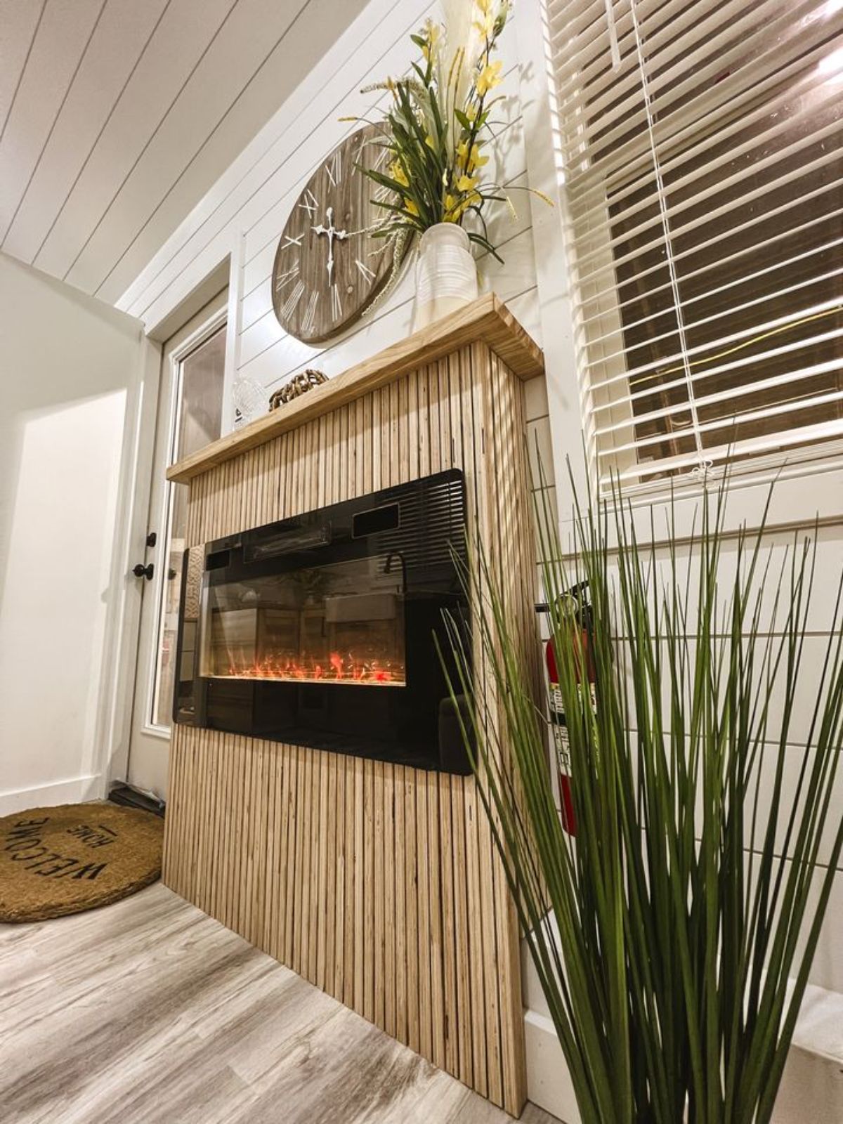 and electric fire place in living area makes the house warmer during winter