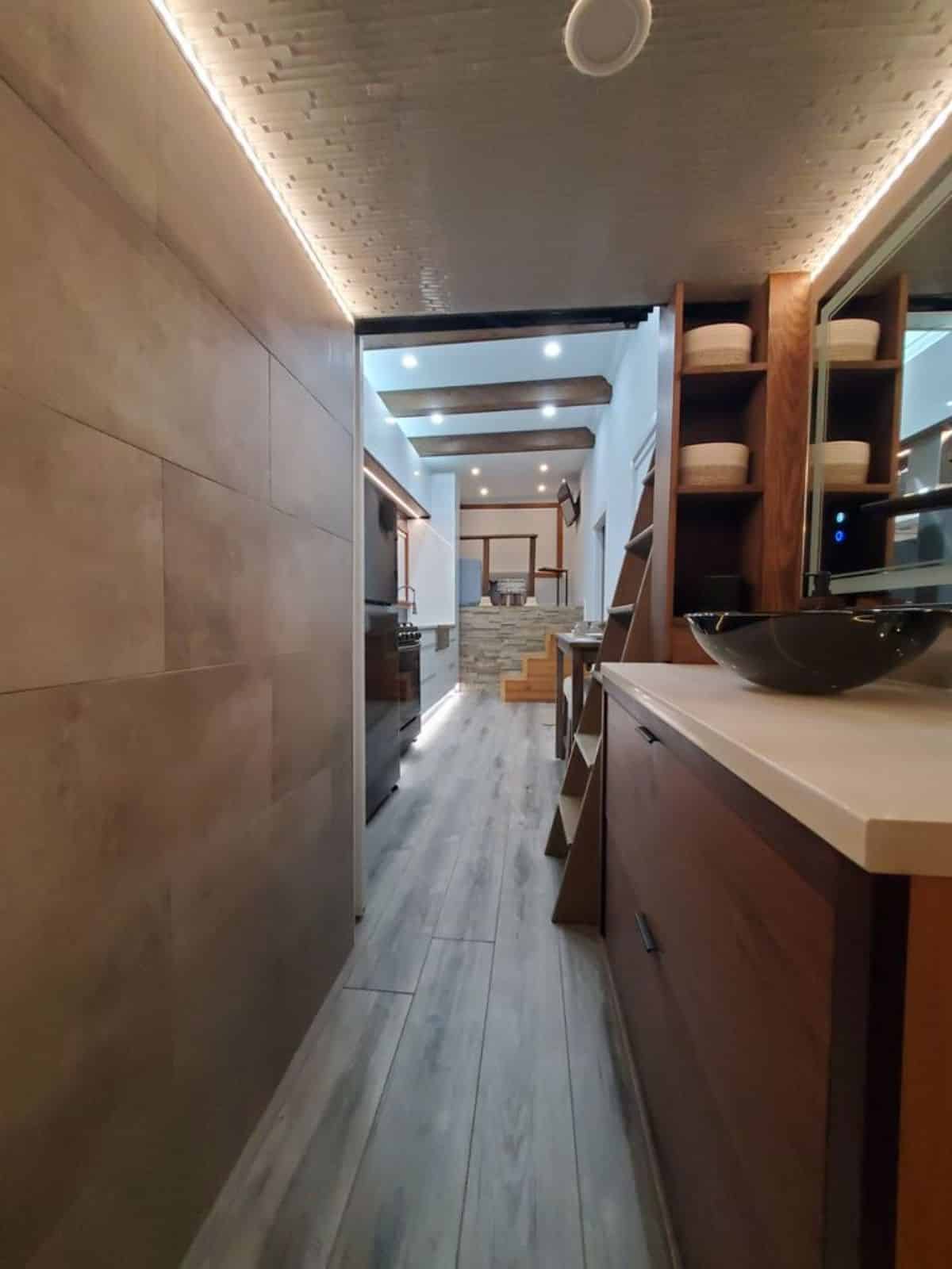full length view of 30’ luxury tiny house on wheels from inside