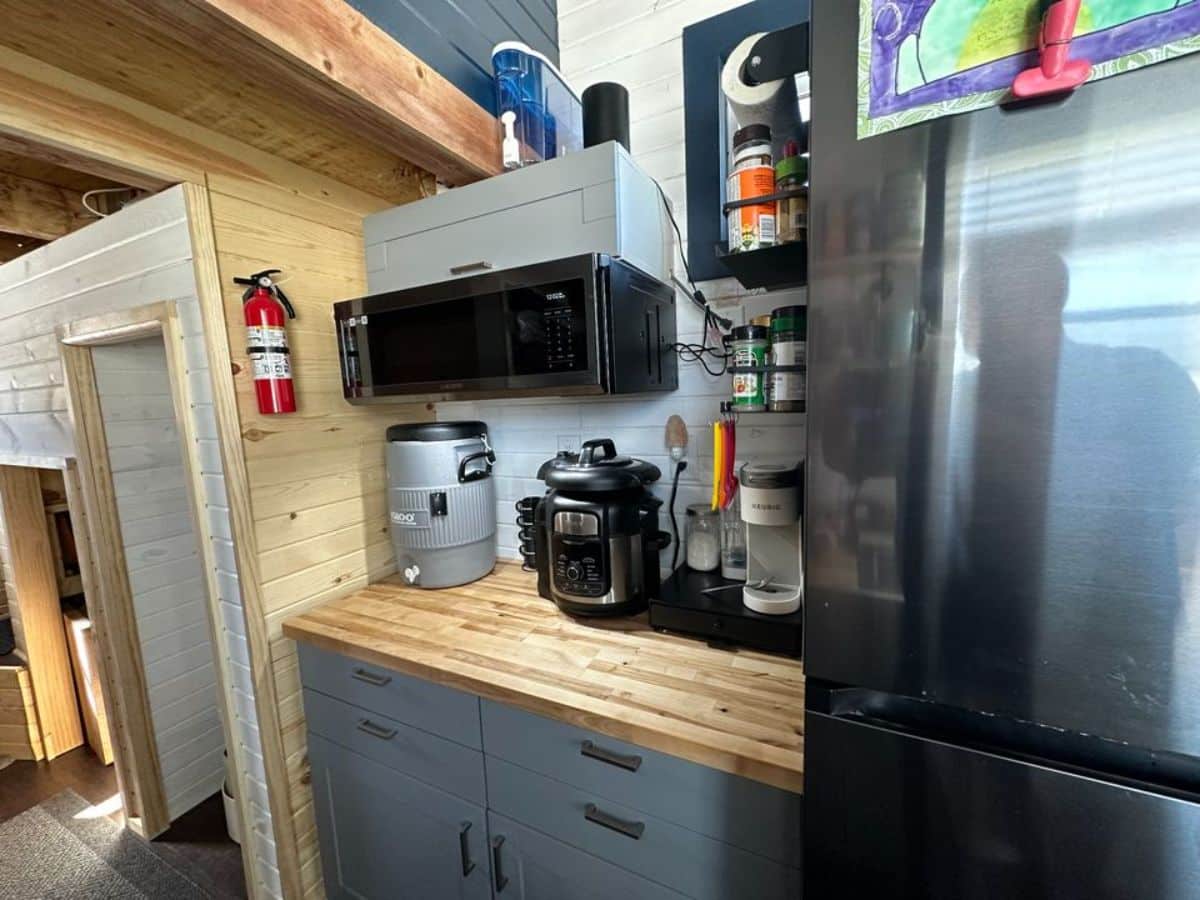 few essential appliances present in the kitchen of 32' fully furnished tiny home