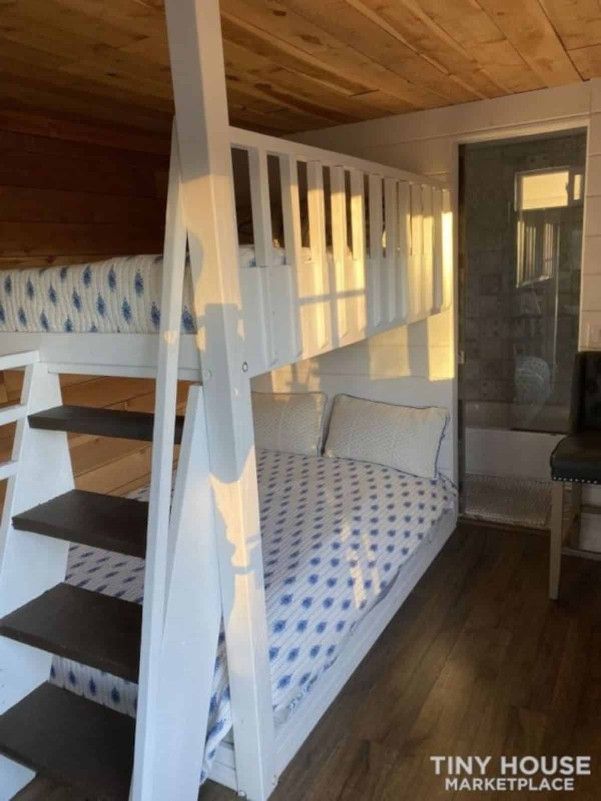 bunk bed under the loft besides the living area