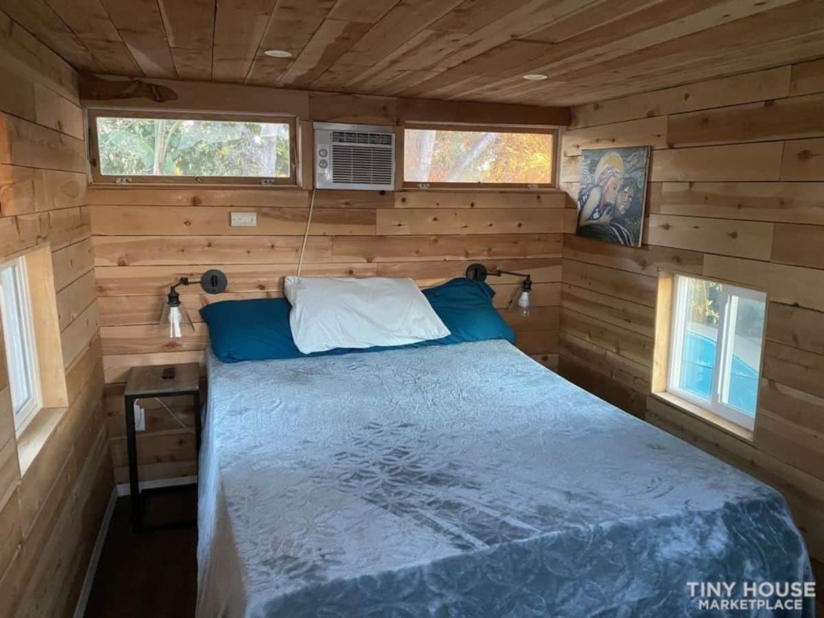 loft bedroom has a queen size bed with ample space left