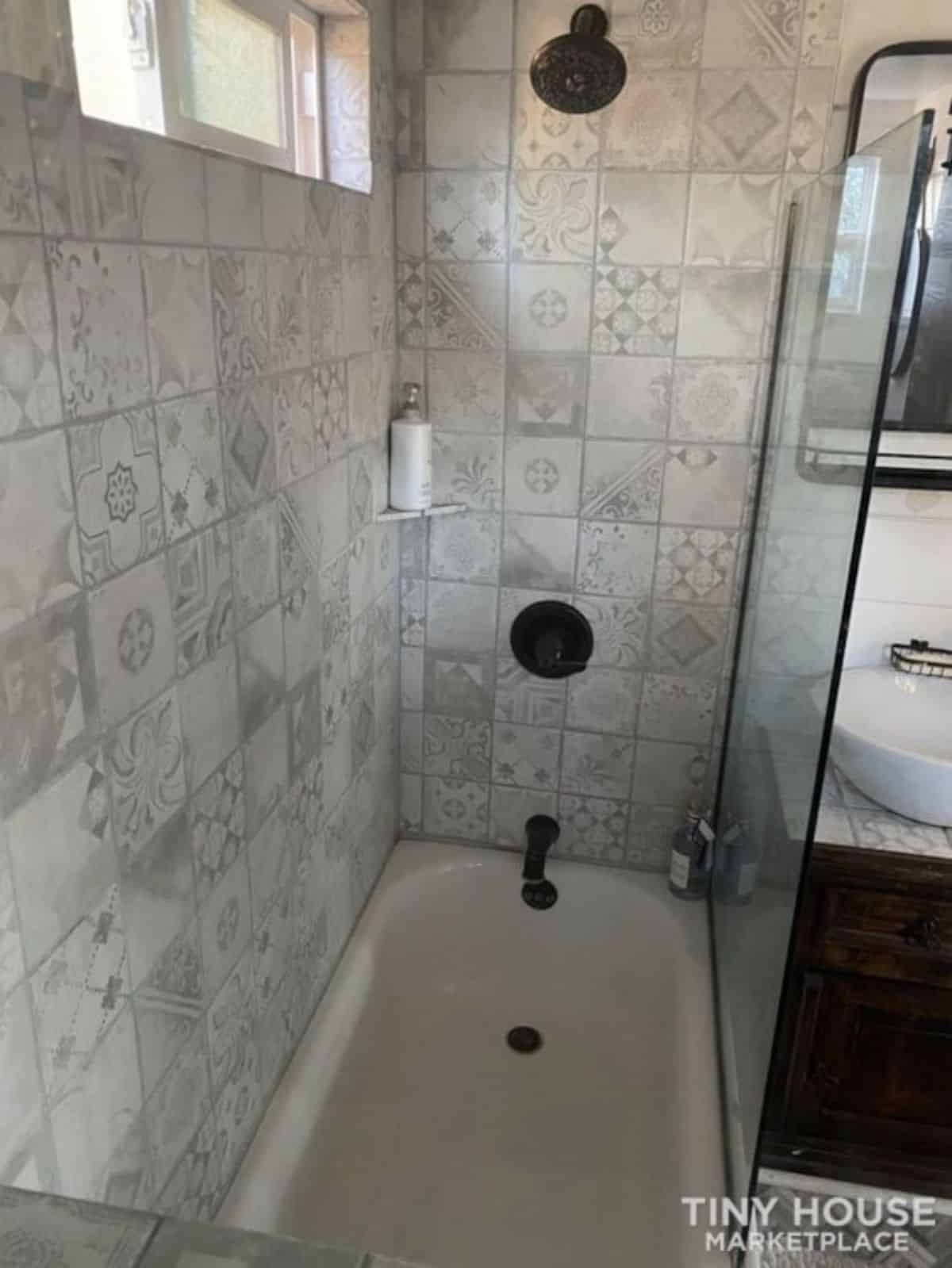 separate shower area with rainfall shower