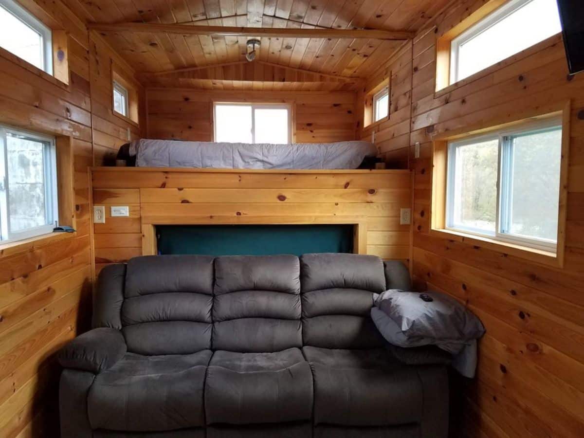 living area of rustic motorhome has a comfortable couch