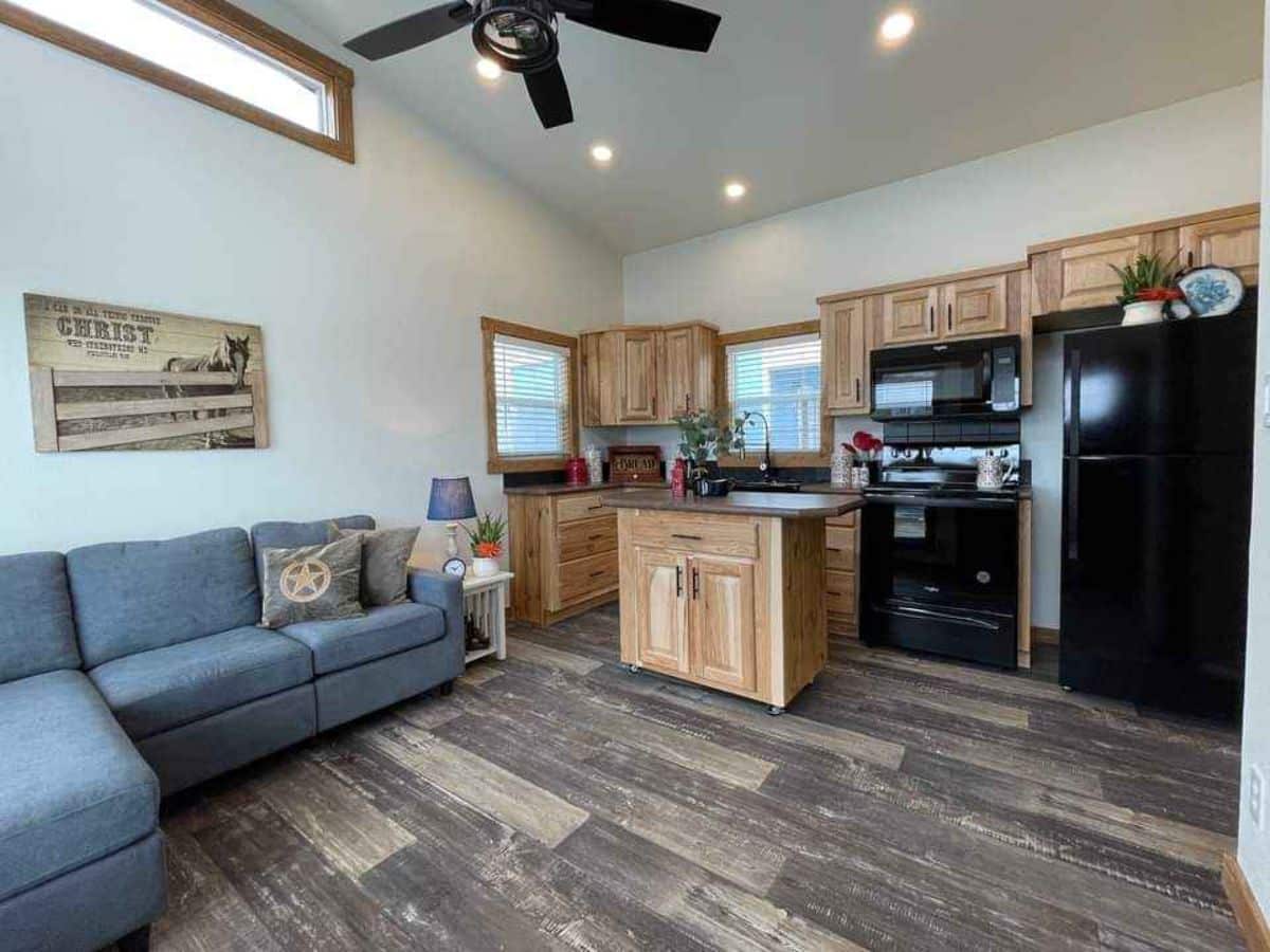 kitchen island makes the nice dining area of cottage tiny home