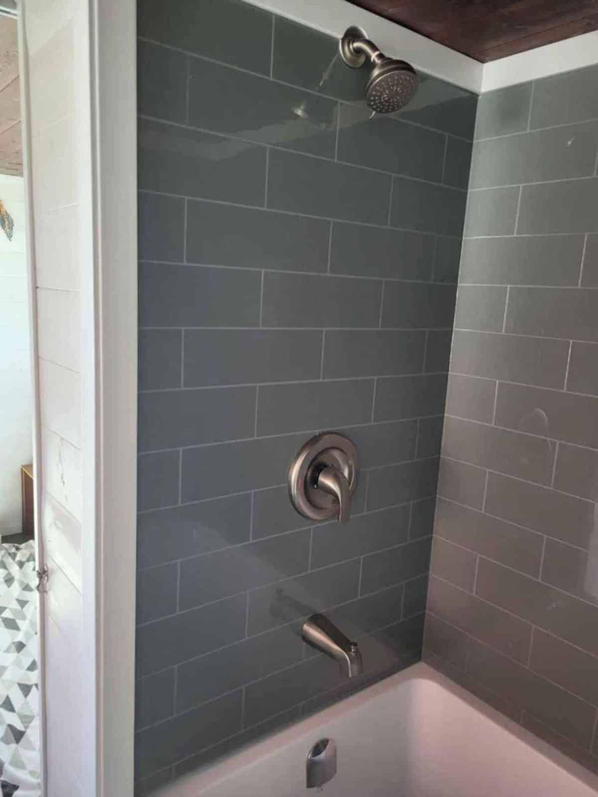 shower area in bathroom of Willow model tiny home
