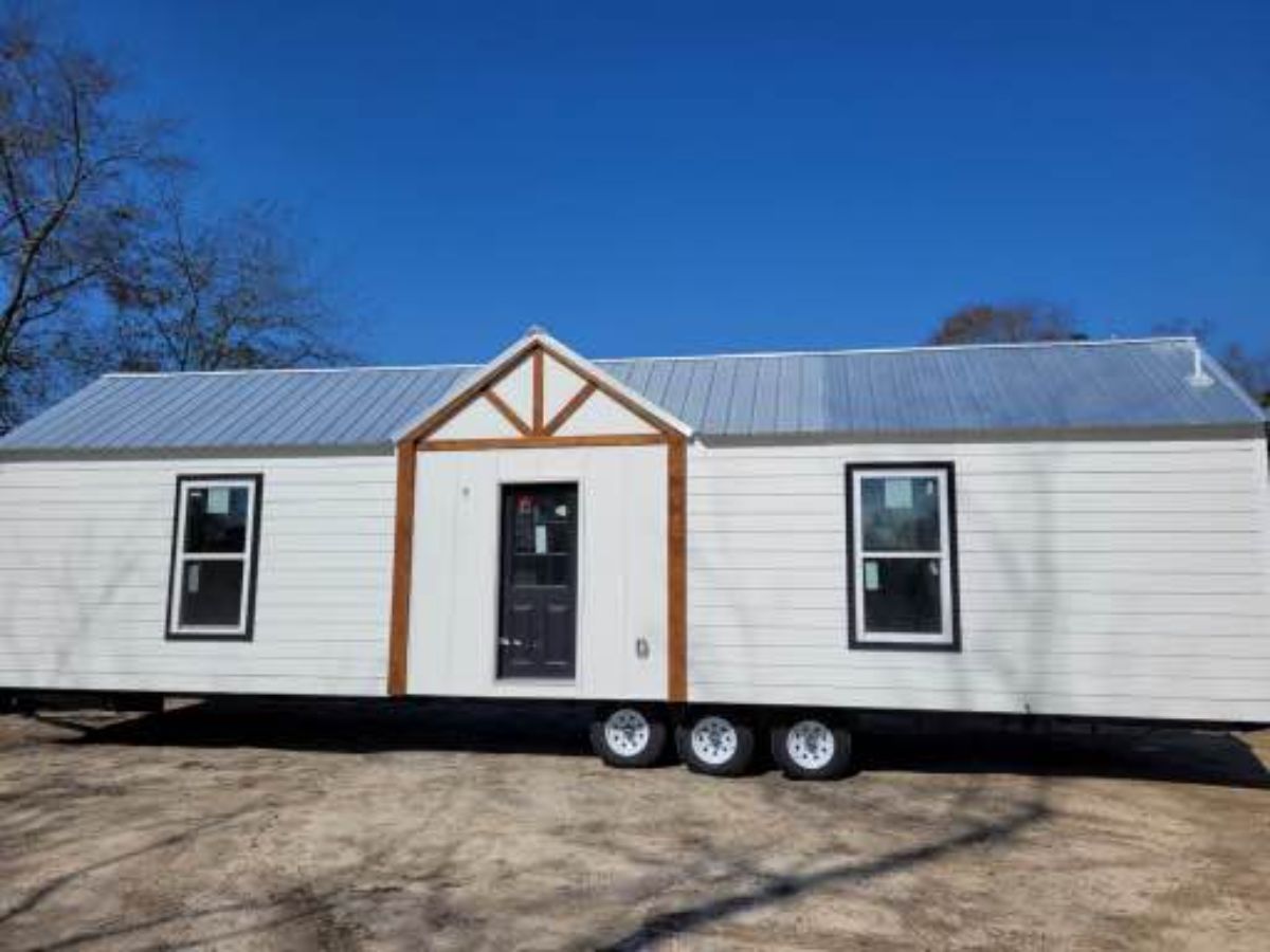 main entrance and stunning exterior of 40' spacious tiny house