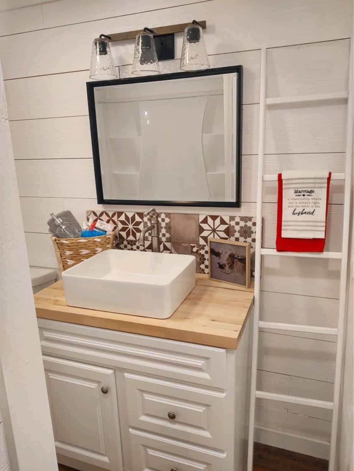 bathroom of 40' spacious tiny house has all the standard fittings