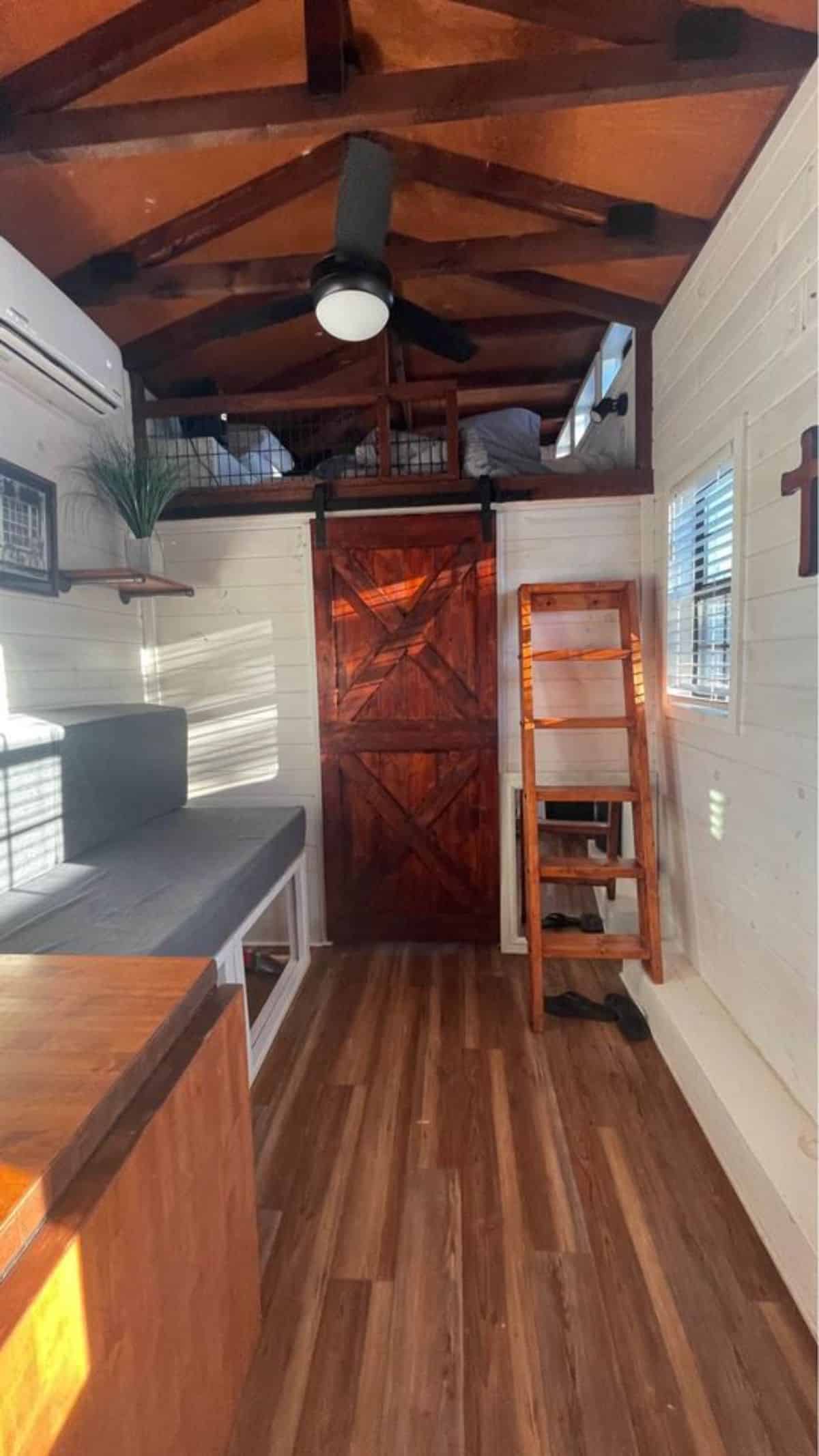 wooden walls and flooring of tiny home for four