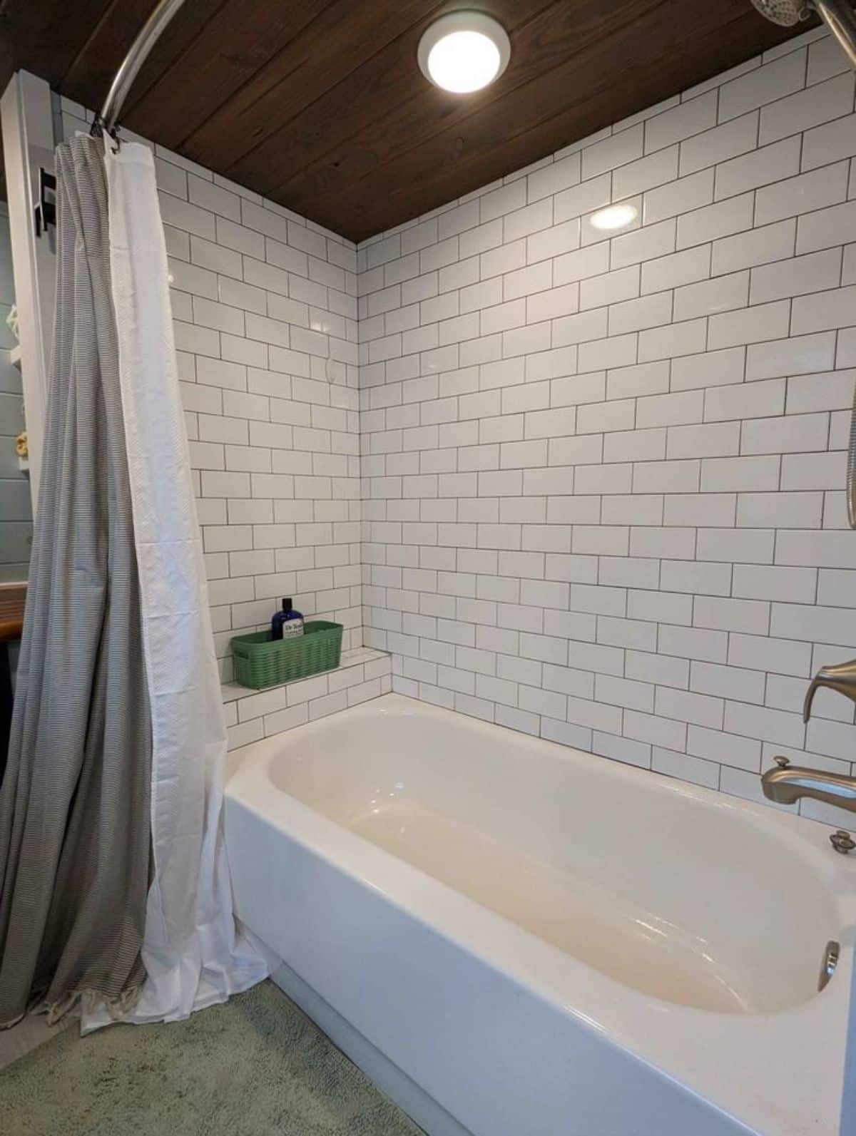 bathtub in bathroom of custom home on wheels