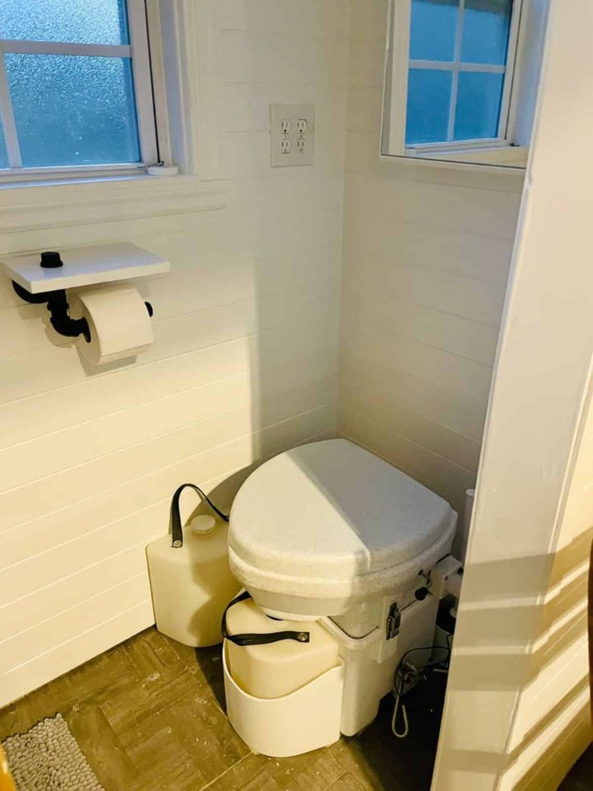 composting toilet in bathroom of compact 20’ tiny house
