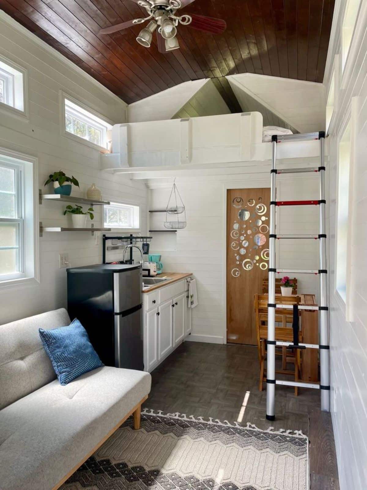full length interiors view of compact 20’ tiny house