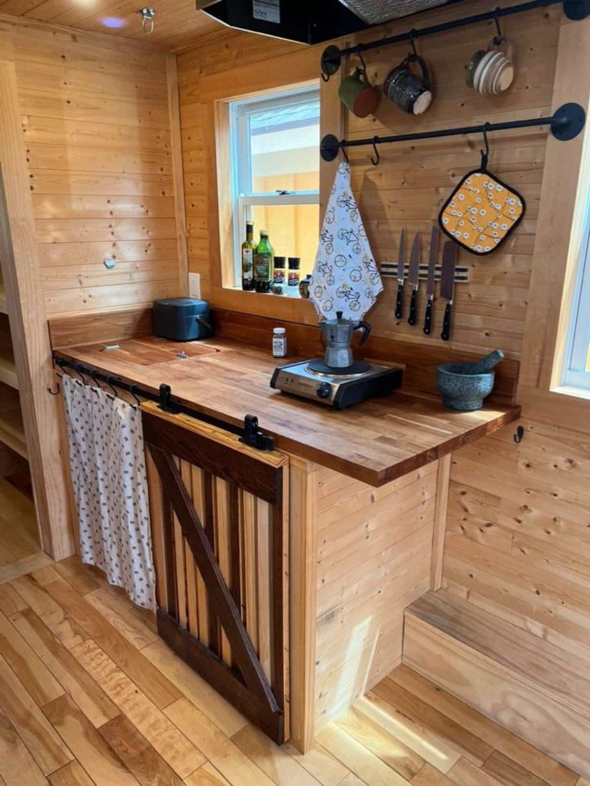 compact kitchen area of 20’ compact tiny home