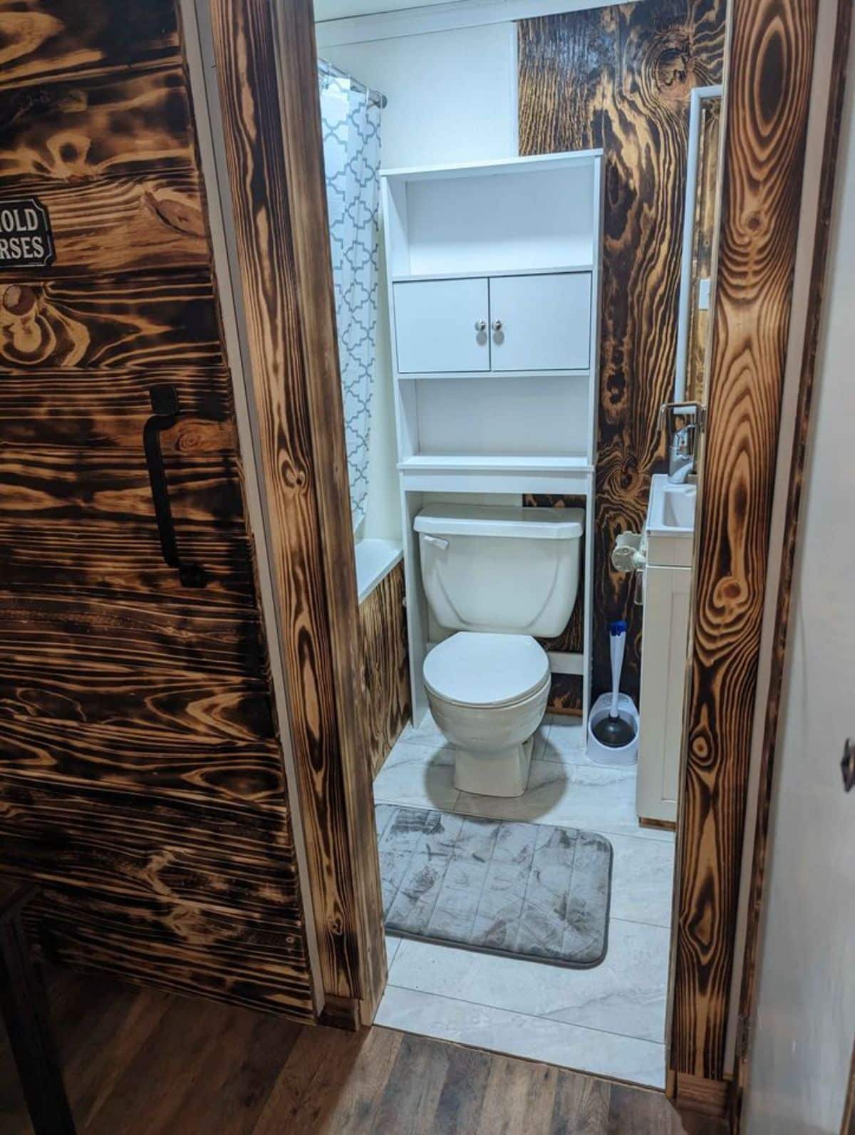bathroom of double lofted mobile home has all the standard fittings