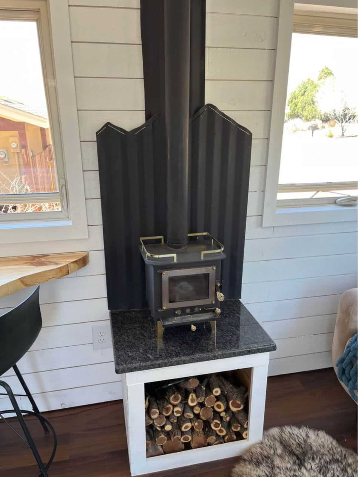 wood stove in living area of newly renovated tiny home
