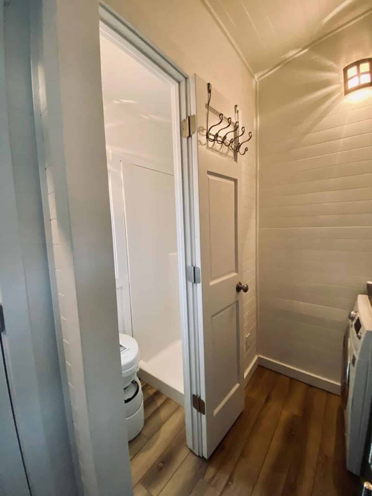 sliding door leading to the bathroom of Tumbleweed tiny home