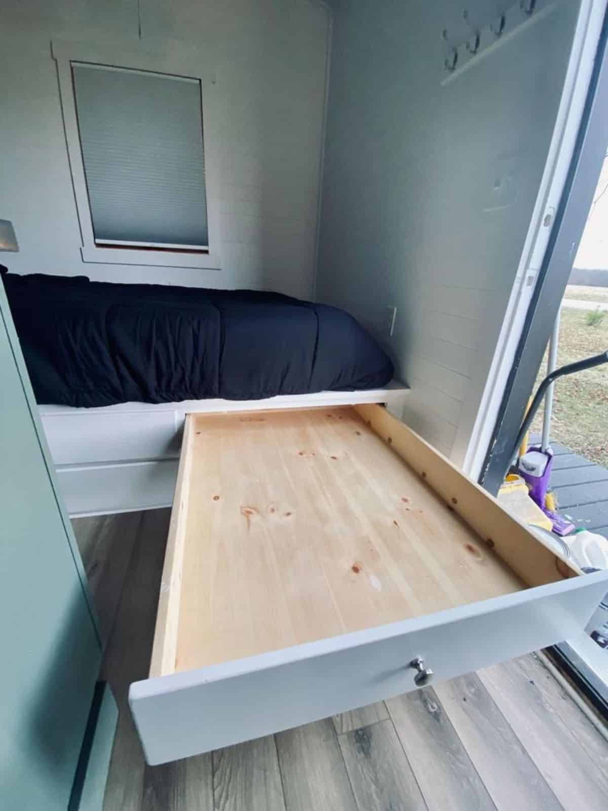 storage underneath the bed of Tumbleweed tiny home