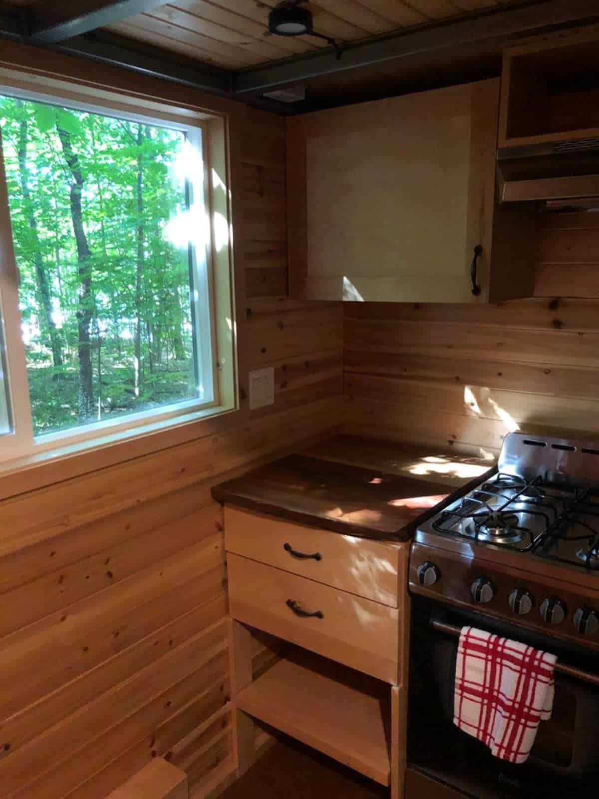 storage cabinets on the corners of super tiny house