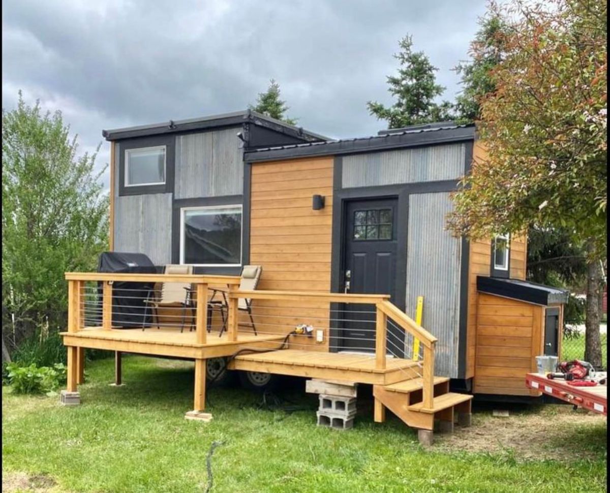 main entrance and stunning exterior view of 20' lightweight tiny home