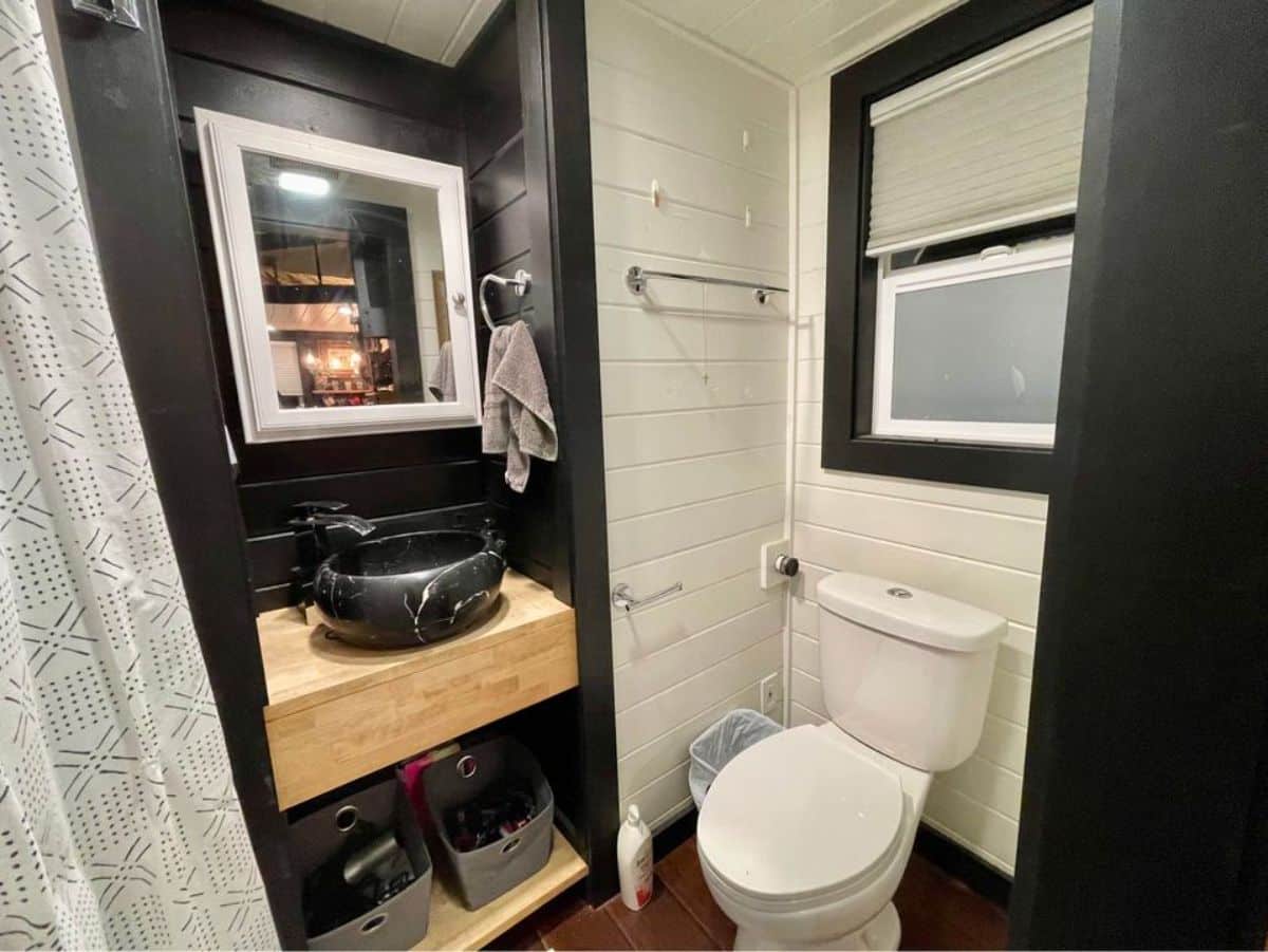 bathroom of 20' lightweight tiny home has all the standard fittings
