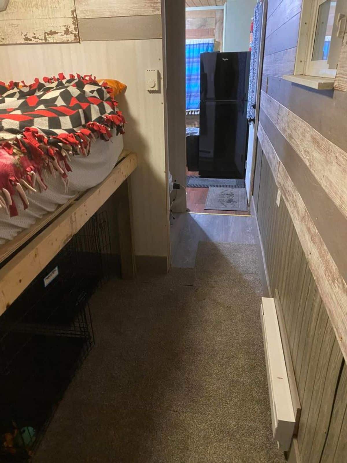 walk away space between bedroom and kitchen of 20' remodeled tiny home