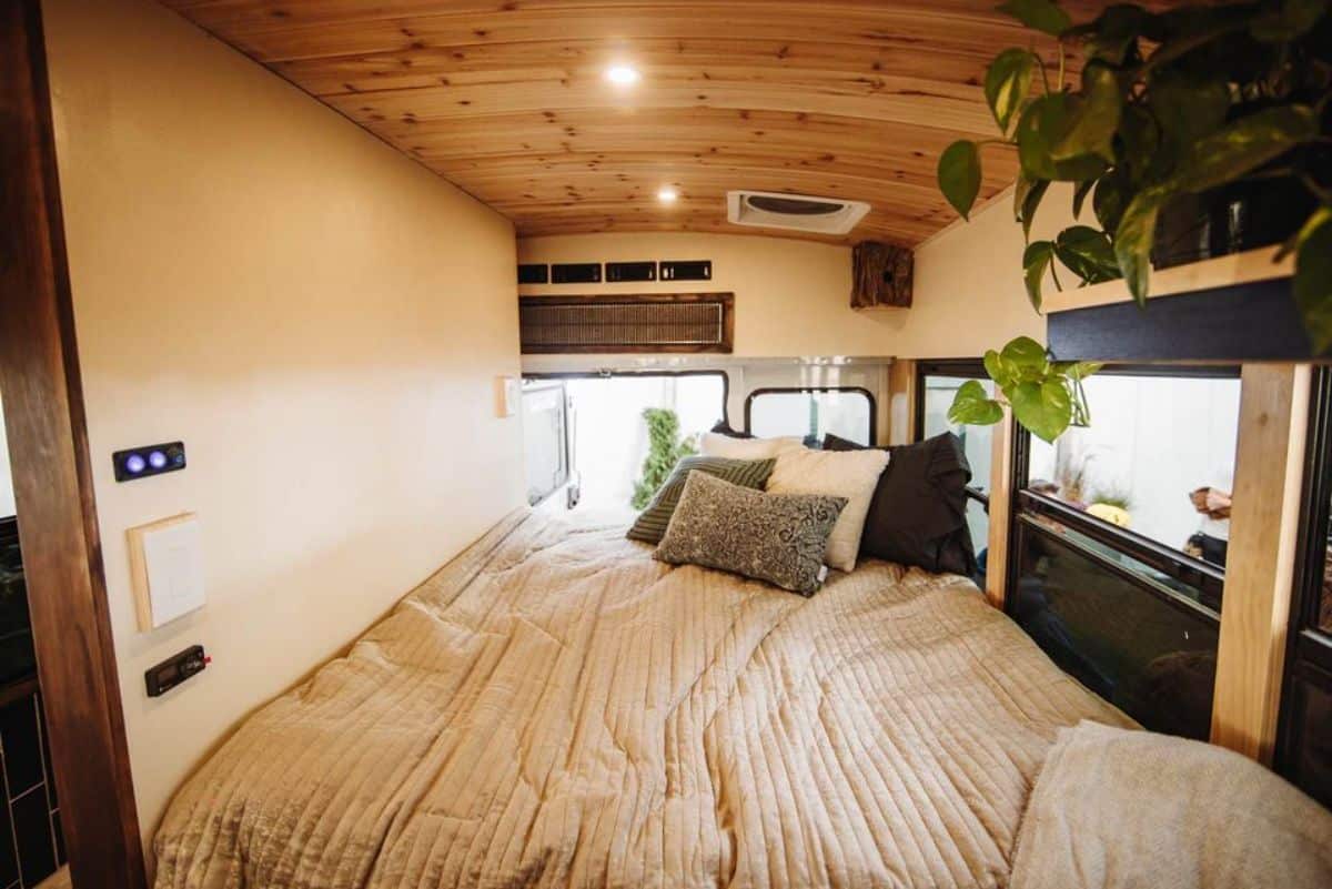 double mattress bed in sleeping area of renovated micro home