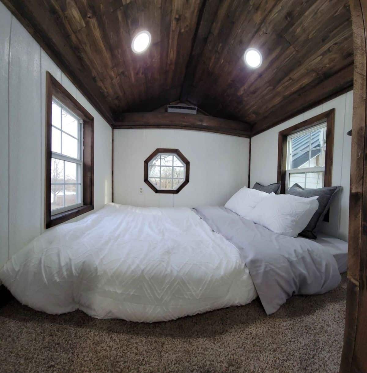 Loft bedroom has a stunning comfortable bed with huge windows and an ample space