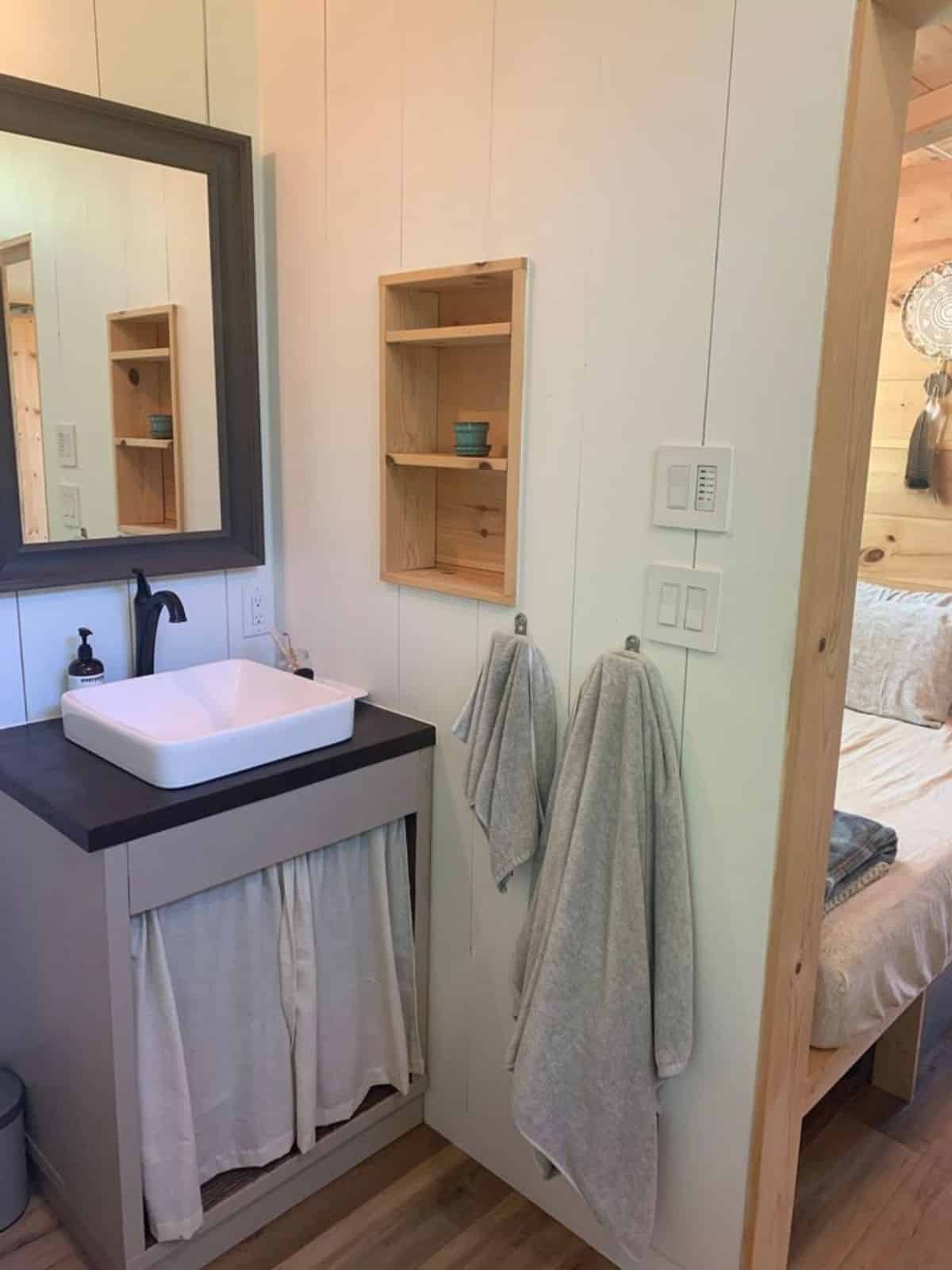 sink with vanity in bathroom of 28’ custom tiny home