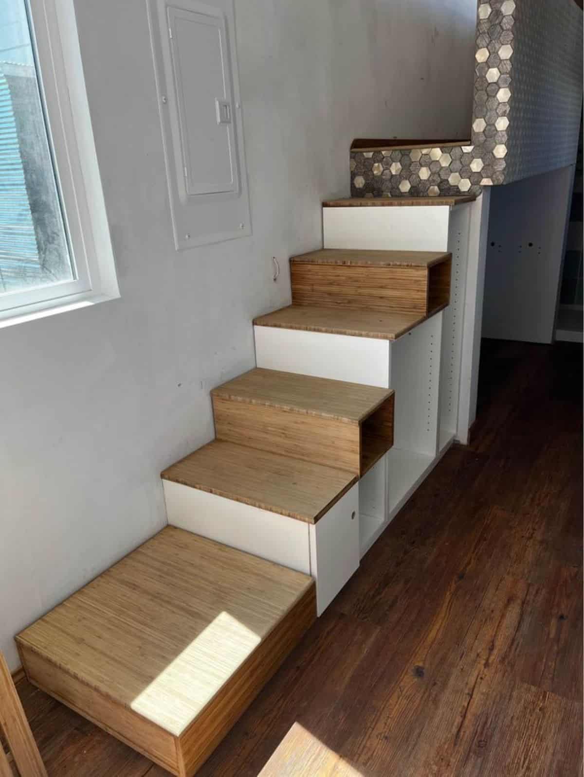 stairs leading to the main loft of luxury home on wheels