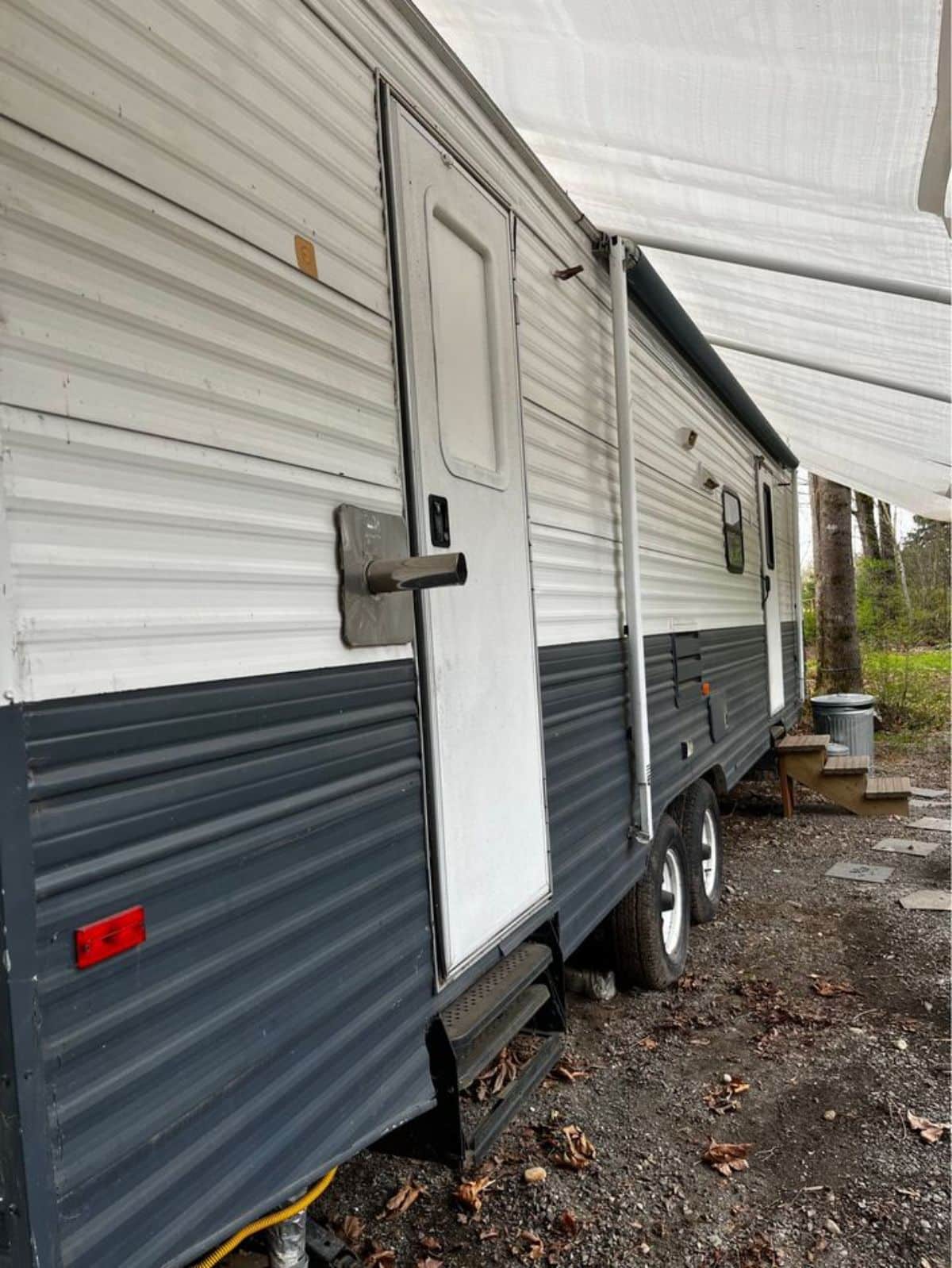 iron walls on the exterior of revamped tiny home on wheels