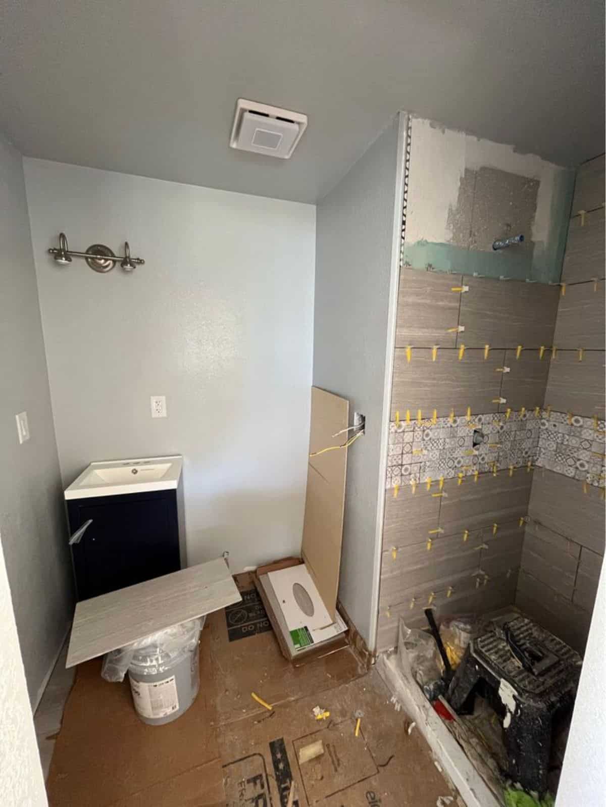 bathroom of 32' one bed tiny home has all the standard fitting