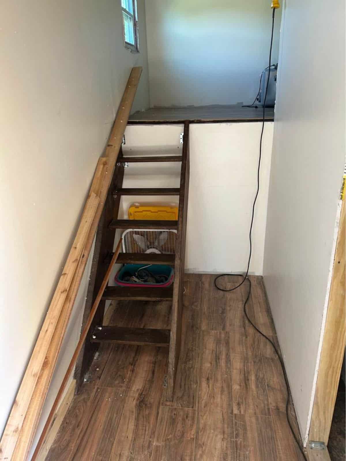 ladder leading to the loft of drivable tiny home
