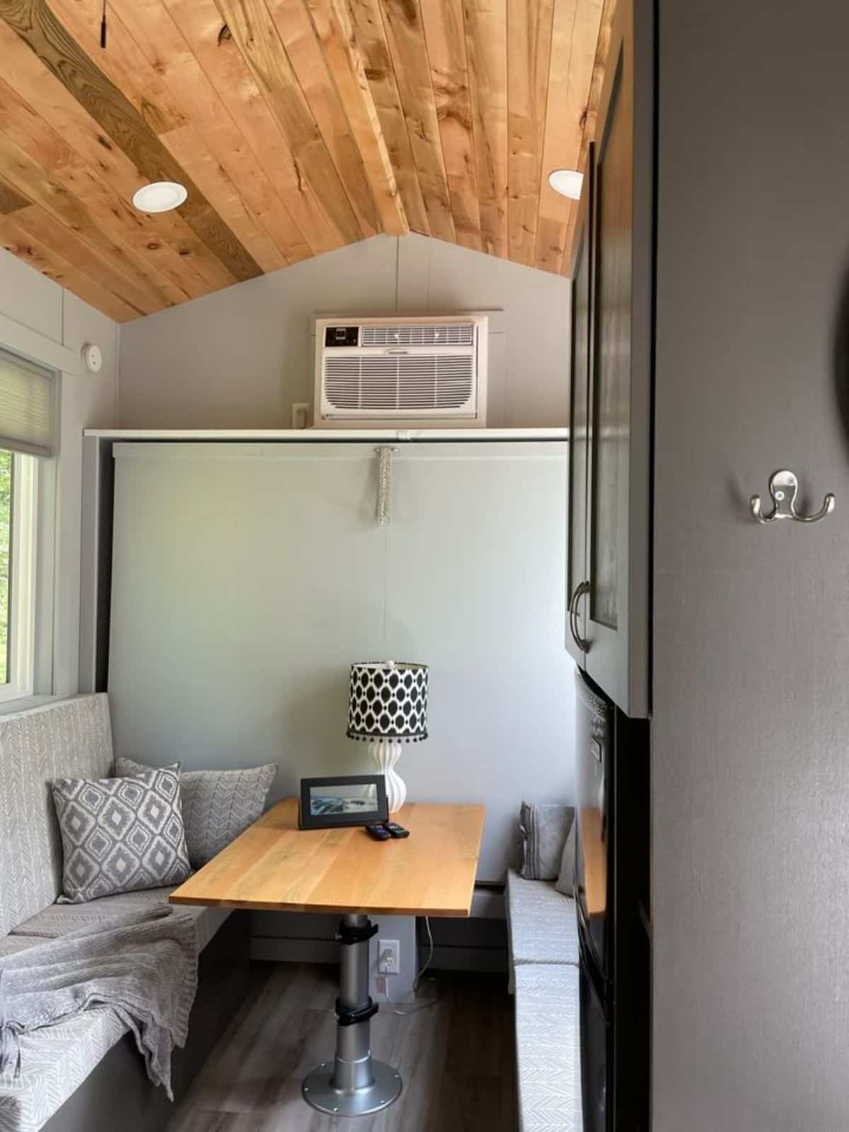 living area of high end tiny home has a couch on both the sides