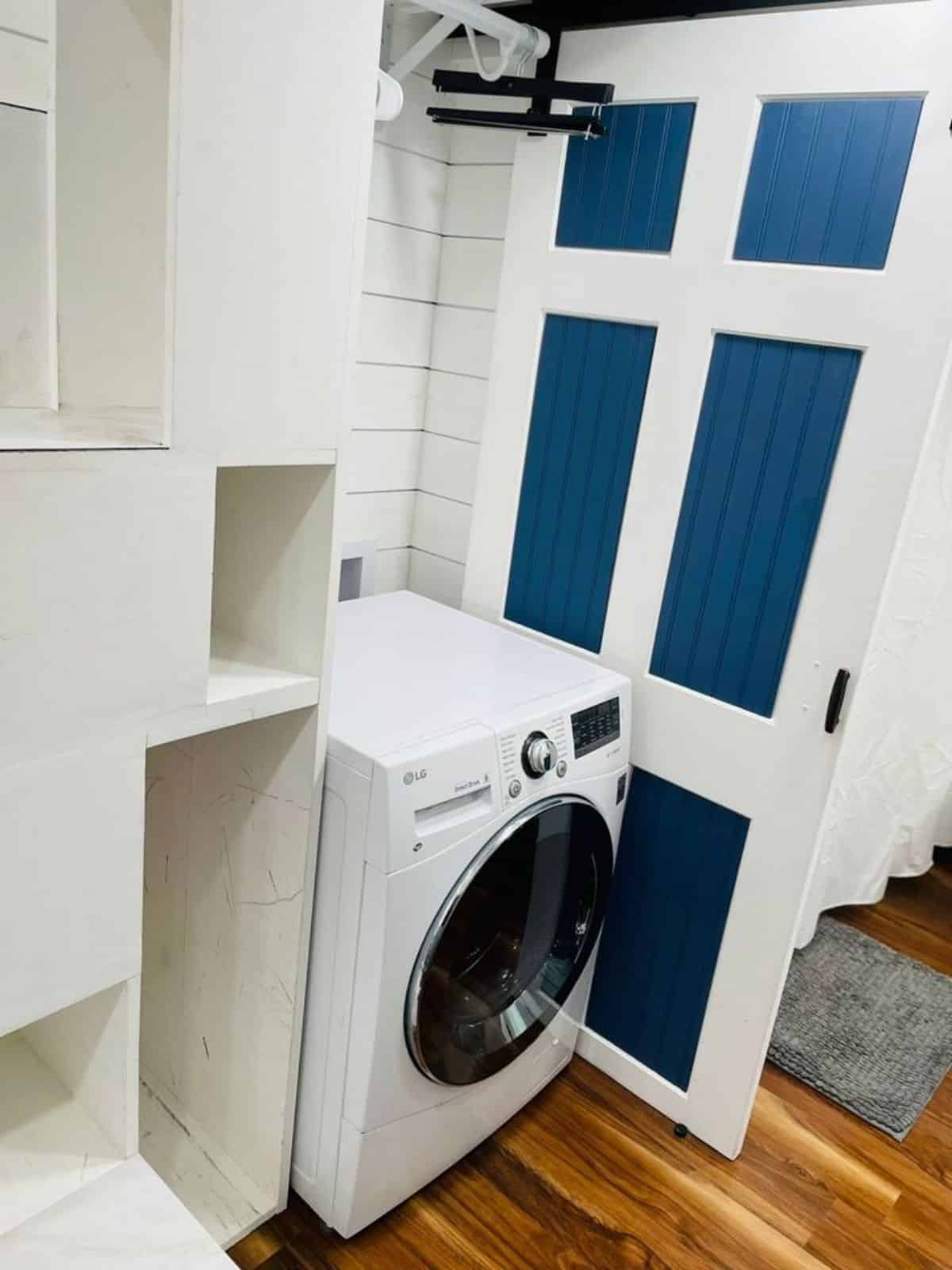 washer dryer combo in bathroom of fully equipped home